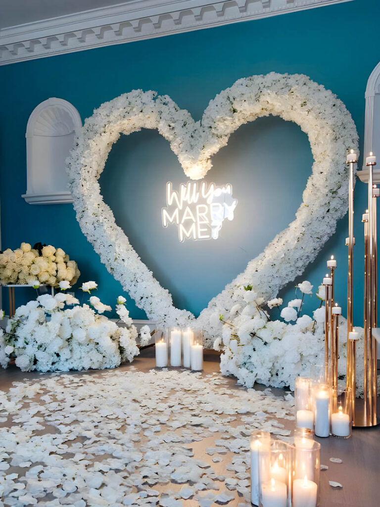 Indoor White Floral Heart Arch on Blue Wall