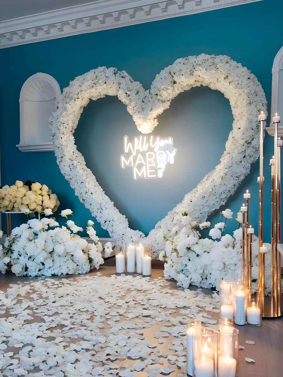 Indoor White Floral Heart Arch on Blue Wall