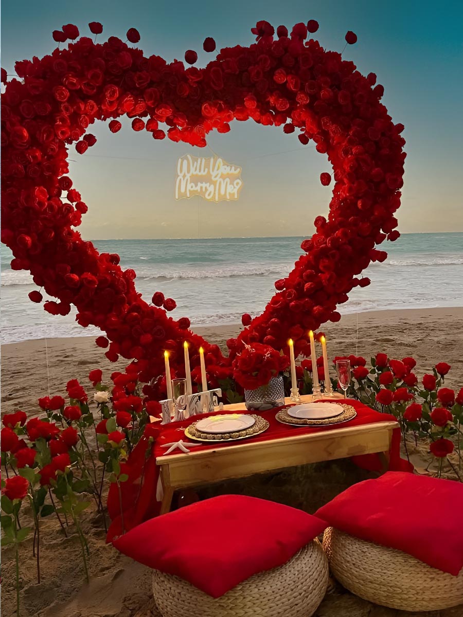 Romantic Beach Proposal with Red Rose Heart Arch