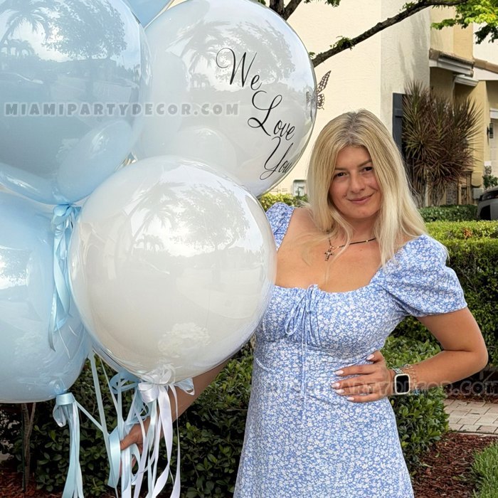 Olesia Holding A Cluster Of White Balloons Outdoors