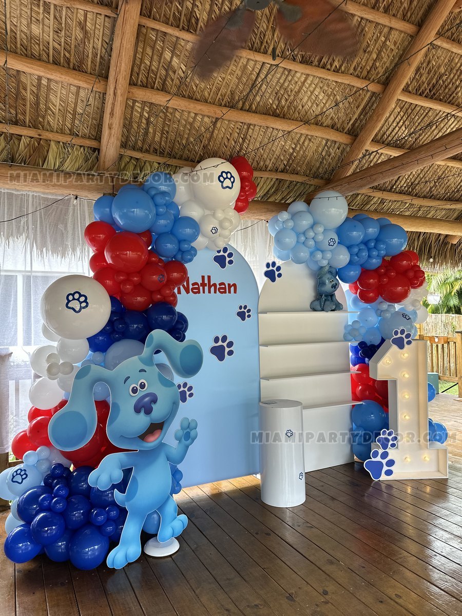 Blue, White, And Red Puppy-Themed First-Birthday Balloon Display