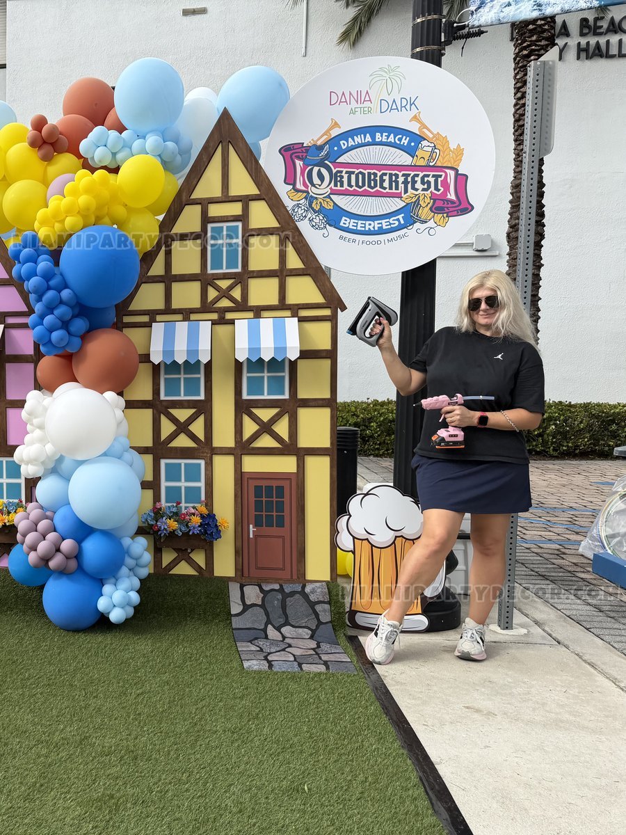 Olesia Beside An Oktoberfest-Themed Balloon Installation