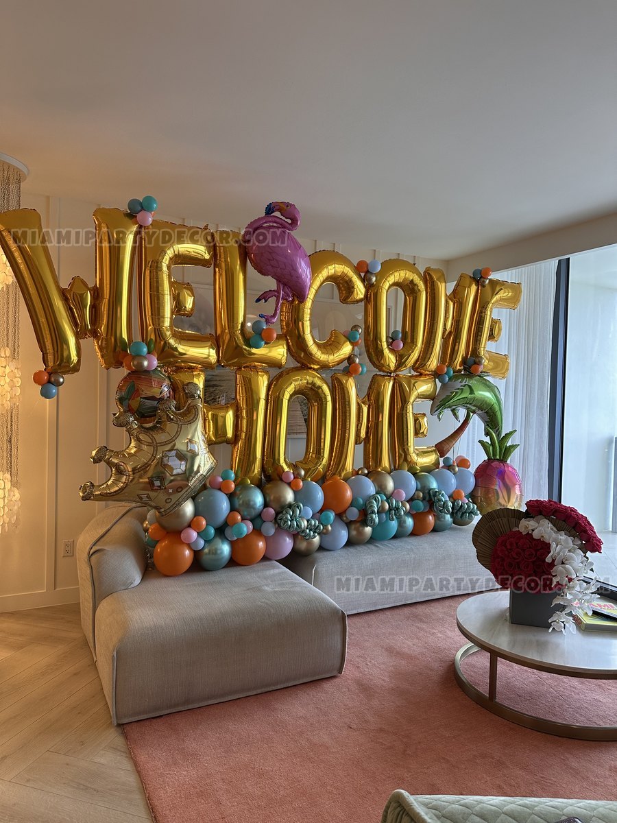 Gold Welcome Home Balloon Display In A Living Room