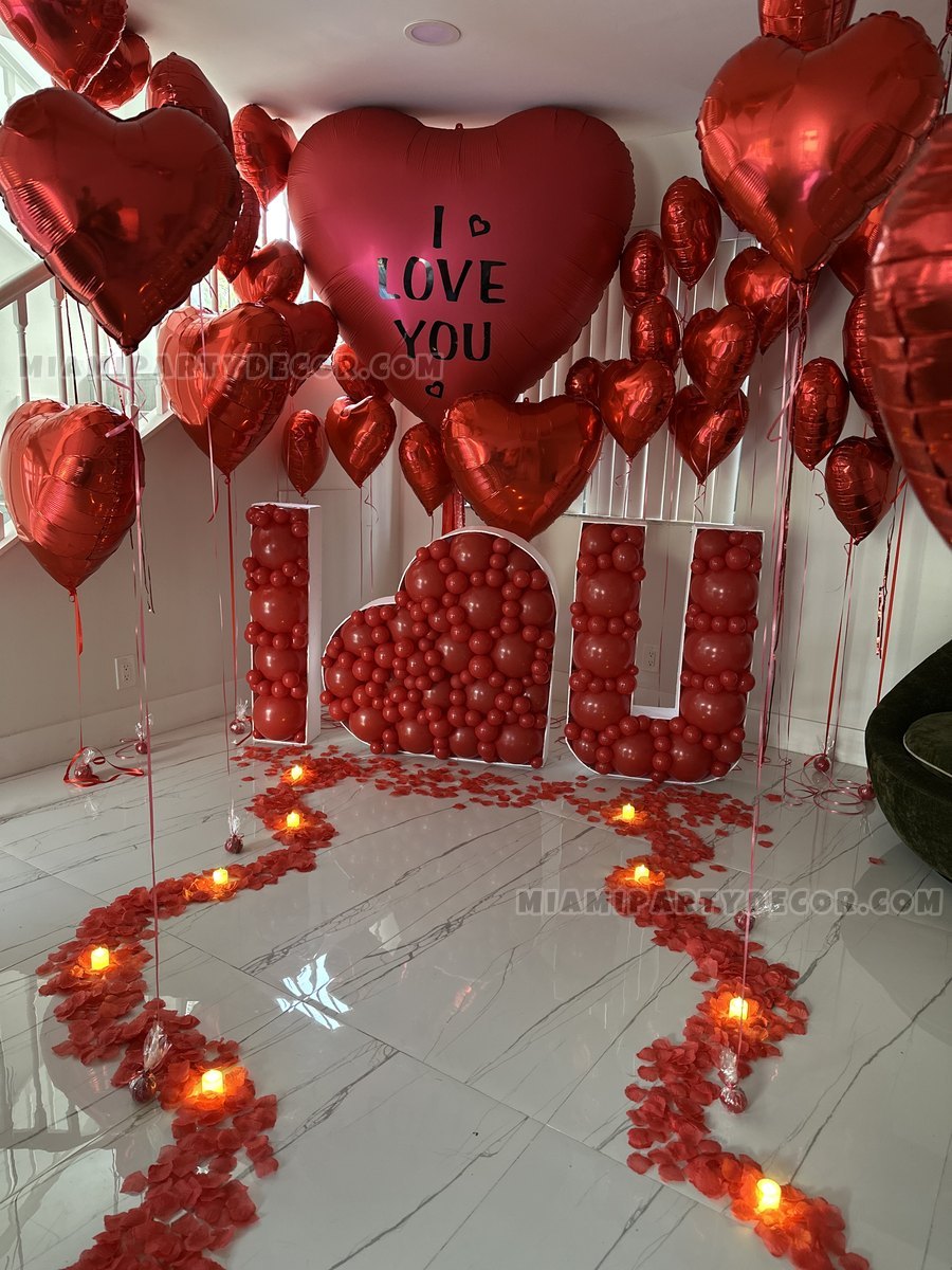 Red Heart Balloons And An I Love You Display In A Bedroom