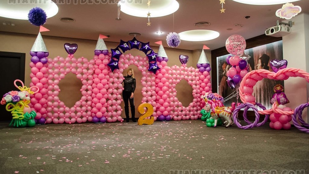 Wide Pink Balloon Castle Installation With Olesia Standing In The Center